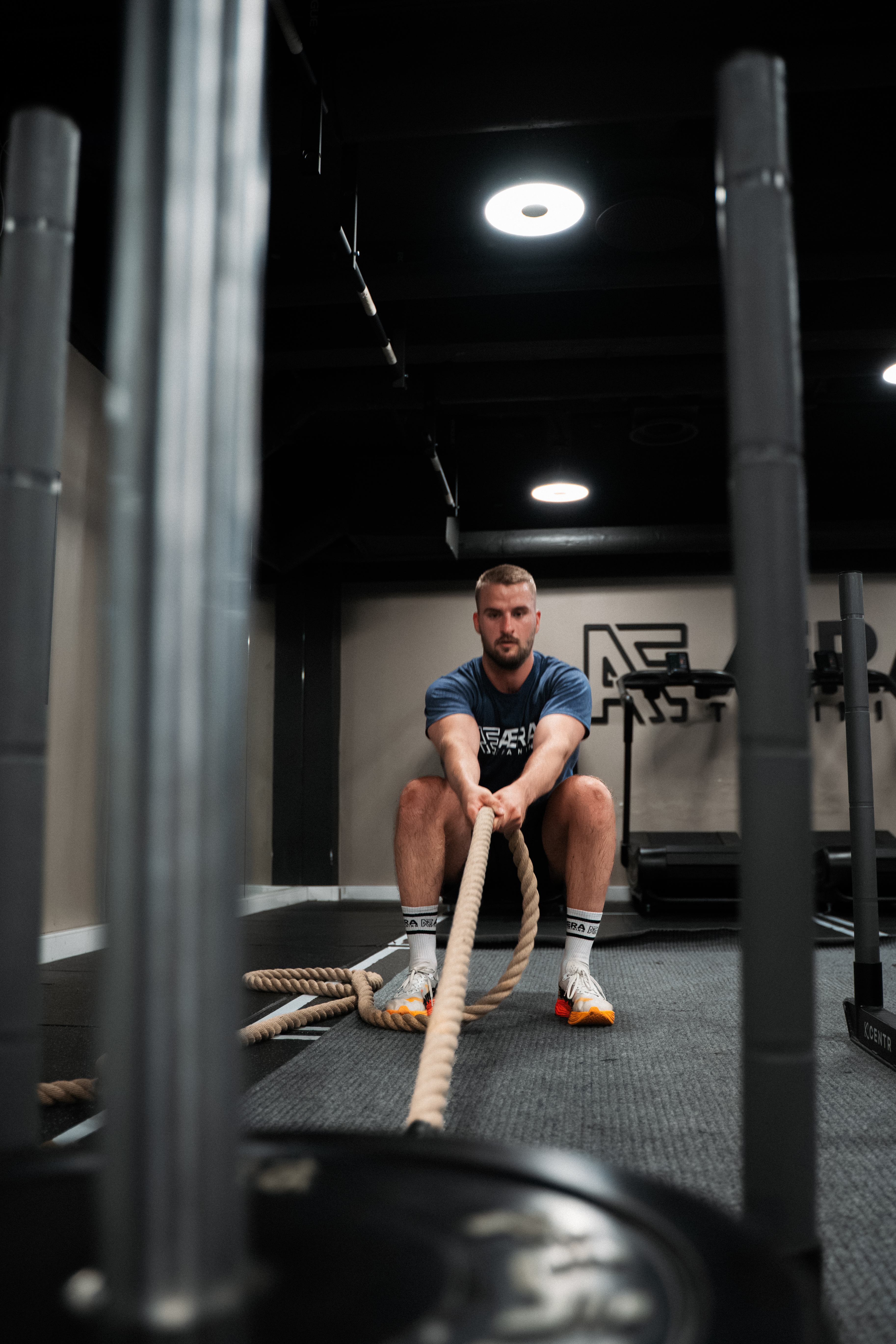 Atlet i battle rope-økt